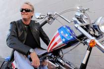Peter Fonda poses atop a Harley-Davidson motorcycle in Glendale, Calif., in 2009. (AP Photo/Ch ...