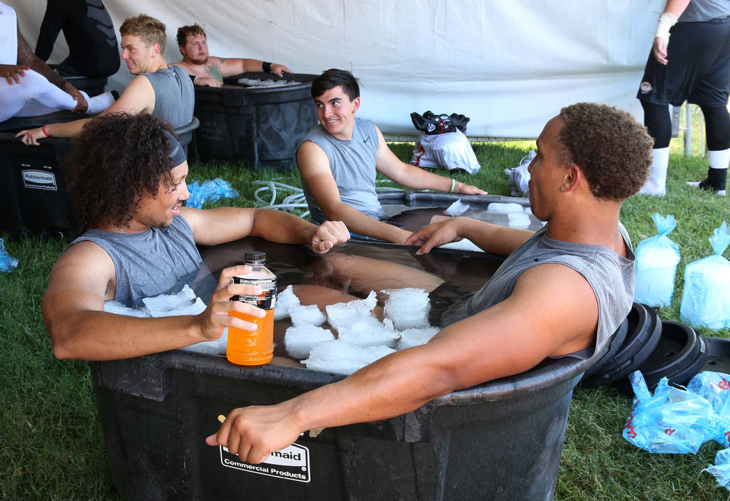 UNLV's defensive back Greg Francis, left, linebacker Tre Caine, right, and kicker Evan Silva, c ...