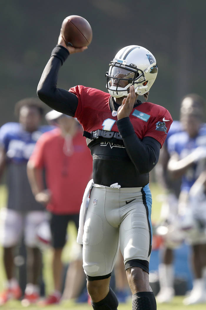 Carolina Panthers quarterback Cam Newton passes during an NFL football training camp with the B ...