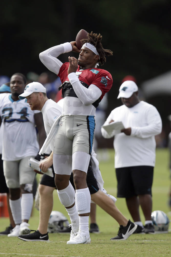 Carolina Panthers quarterback Cam Newton passes during an NFL football training camp with the B ...