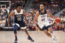 Team White guard Derrick White (46) dribbles the ball past Team Blue guard De'Aaron Fox (20) du ...