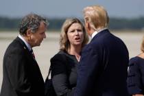 President Donald Trump is greeted by Dayton Mayor Nan Whaley and Sen. Sherrod Brown, D-Ohio, af ...
