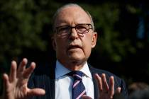 White House chief economic adviser Larry Kudlow talks with reporters outside the White House, T ...