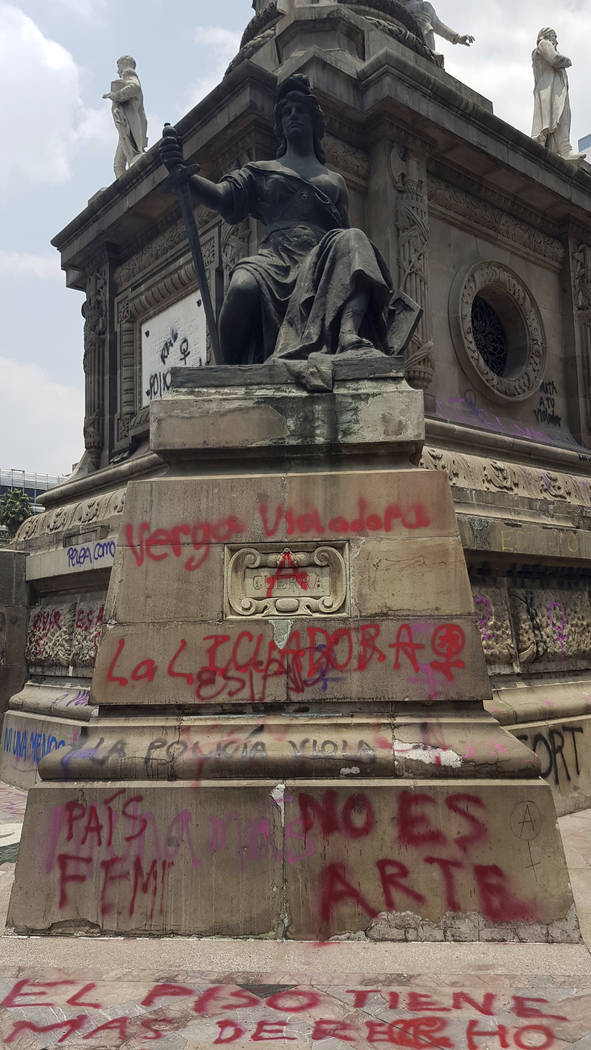 Grafitti covers Mexico City's iconic Angel of Independence, after protesters defaced it, in Mex ...