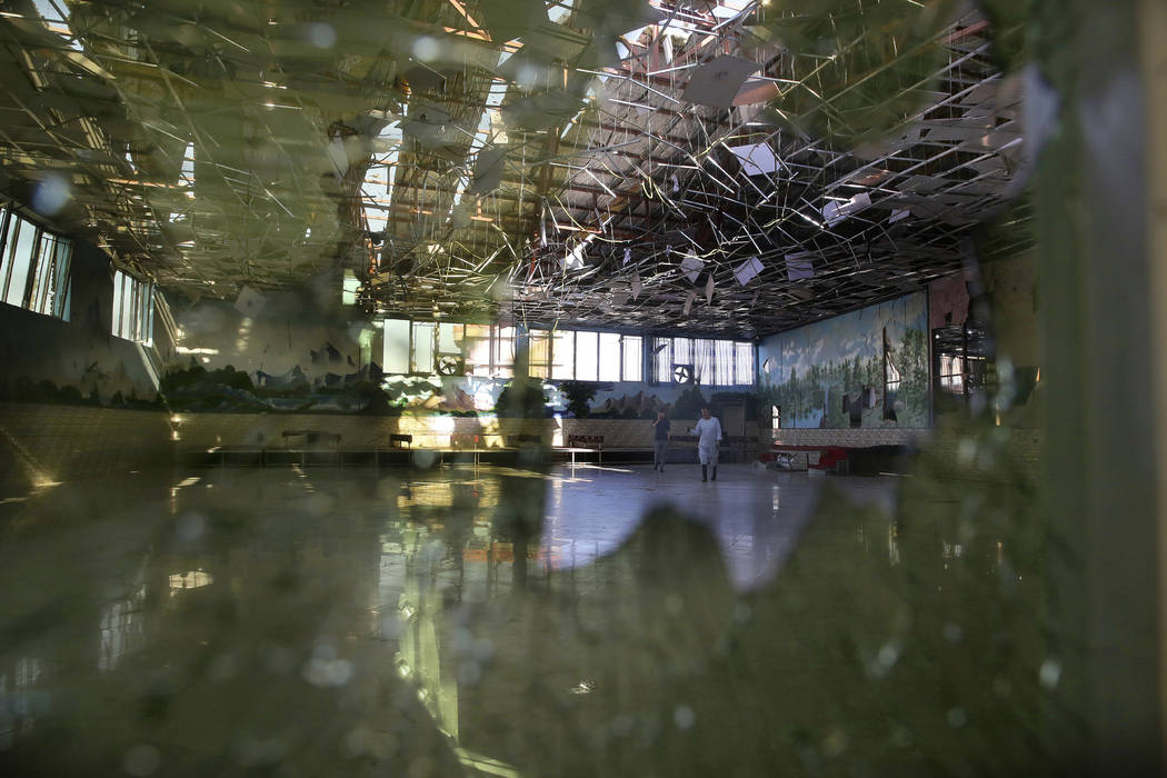 Damage of the Dubai City wedding hall is seen after an explosion in Kabul, Afghanistan, Sunday, ...