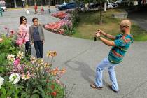 Junar Lim takes photos of Ziah Lim, left, and Arsenia Lim, all of Cavite, the Philippines, at g ...