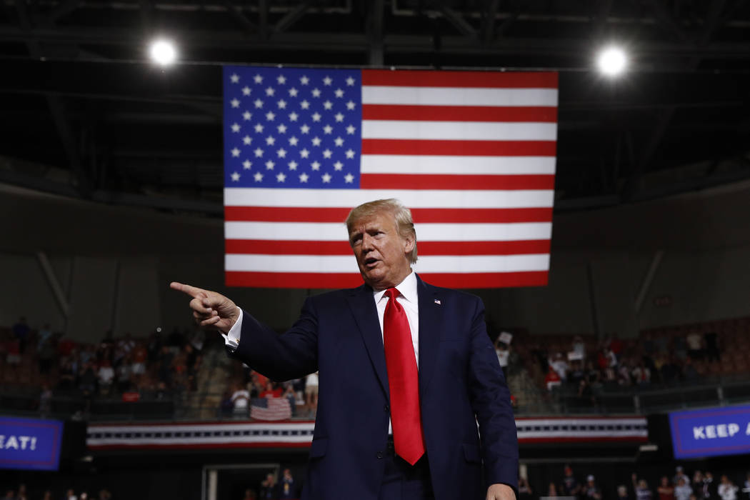 In this Aug. 15, 2019 file photo, President Donald Trump reacts at the end of his speech at a c ...