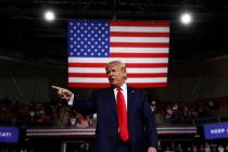 In this Aug. 15, 2019 file photo, President Donald Trump reacts at the end of his speech at a c ...