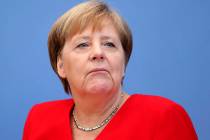German Chancellor Angela Merkel attends her annual sommer press conference in Berlin, Germany, ...