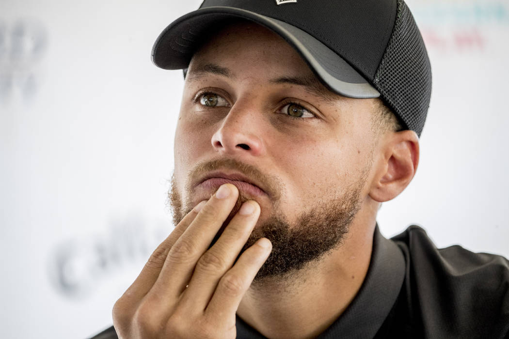 Golden State Warriors guard Stephen Curry attends a news conference at Langston Golf Course in ...