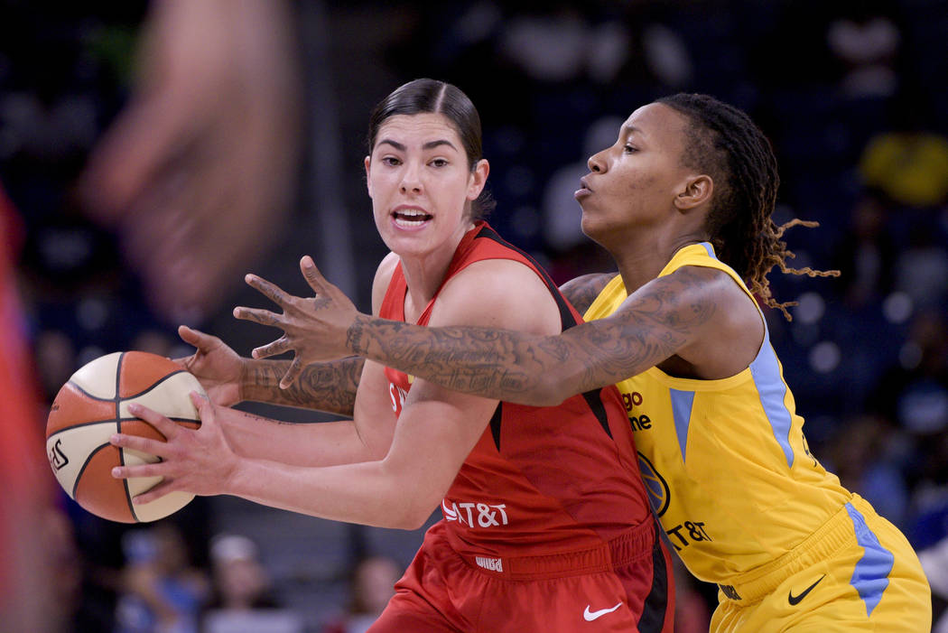 Las Vegas Aces' Kelsey Plum works to keep the ball away from Chicago Sky guard Jamierra Faulkne ...