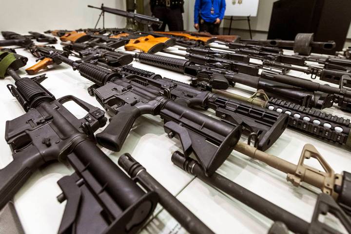 In this Dec. 27, 2012, file photo, a variety of military-style semi-automatic rifles obtained d ...