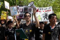 People gather in Lafayette Square in front of the White House in Washington, Sunday, Aug. 18, 2 ...