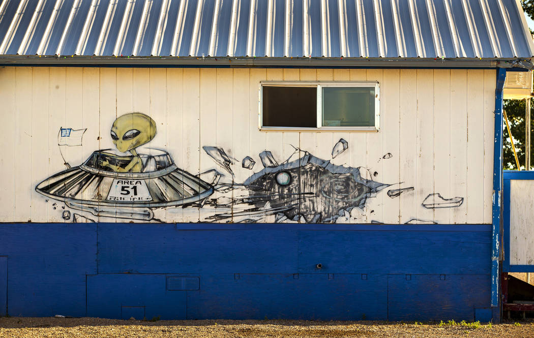 An alien flying in his spacecraft is depicted on the outside of the restaurant at the Little A ...
