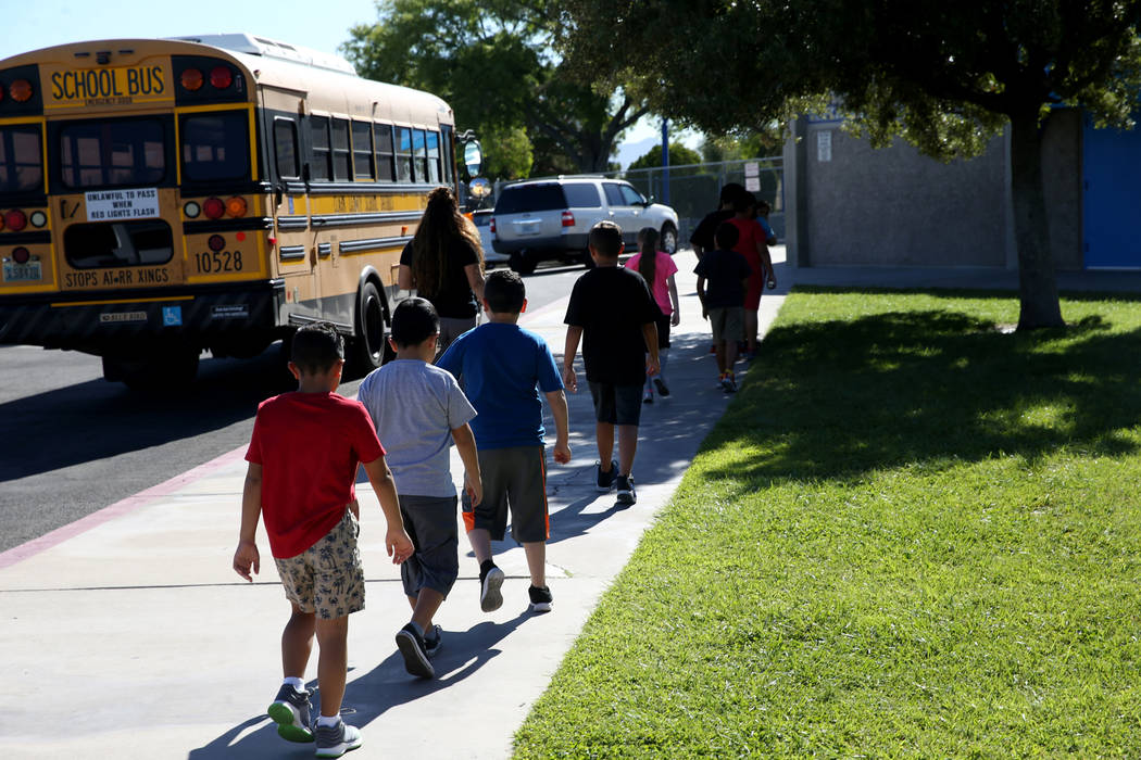 Helen Smith Elementary line up in front of their Las Vegas school, Tuesday, Aug. 20, 2019. (K.M ...