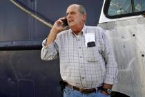 FILE - In this Oct. 14, 2014, file photo, Carlos Rafael talks on the phone at Homer's Wharf nea ...
