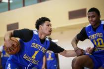 Trinity International junior Daishen Nix (1) drives against teammate Marlon Lestin during a pra ...