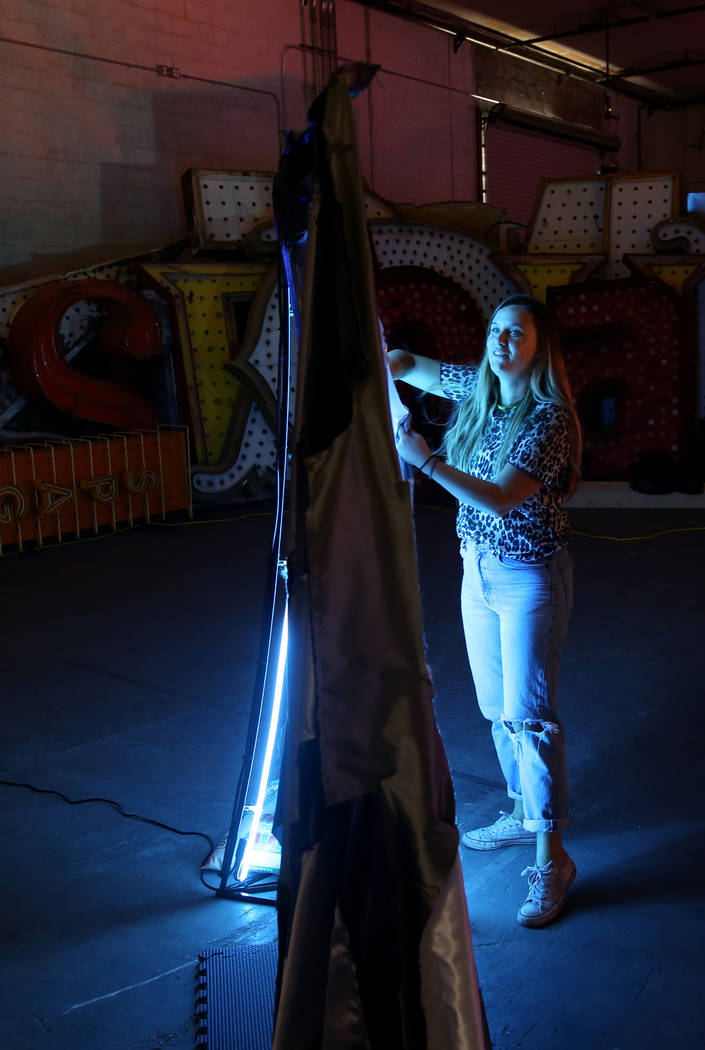 Julie Henson, artist in residence for the Neon Museum, works on one of her sculptures at the mu ...