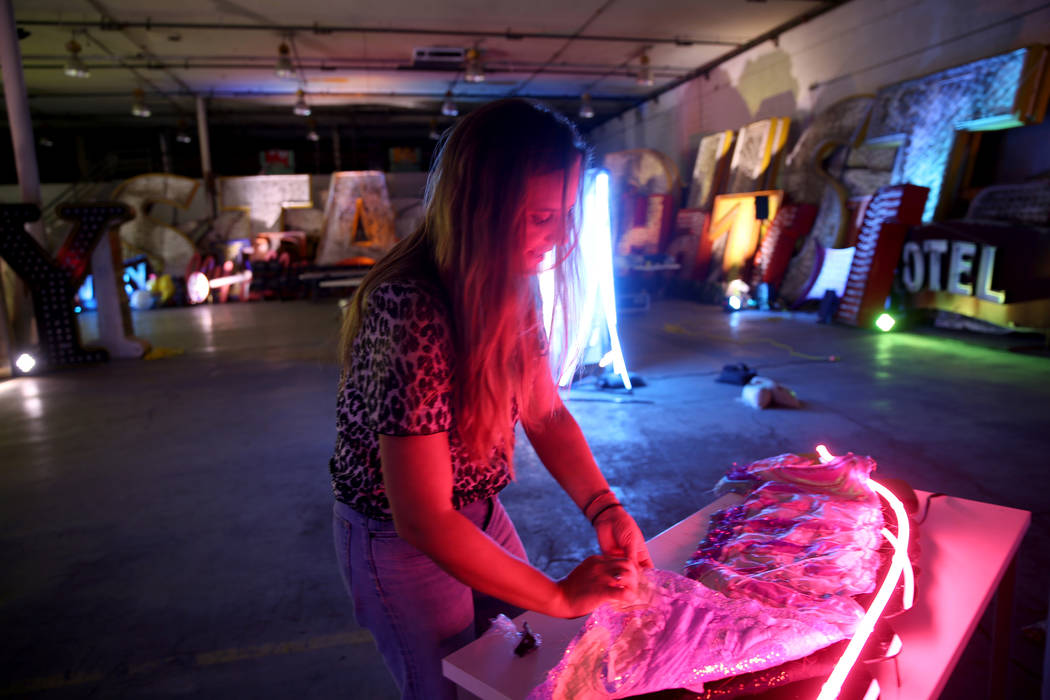 Julie Henson, artist in residence for the Neon Museum, works on one of her sculptures at the mu ...