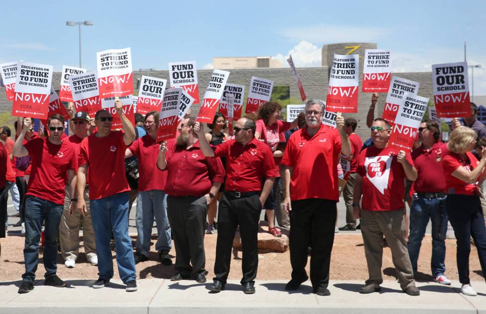 Members and supporters of the Clark County Education Association protest in front of Durango Hi ...