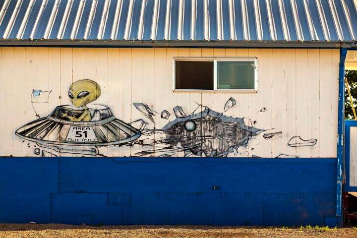 An alien flying in his spacecraft is depicted on the outside of the restaurant at the Little A' ...