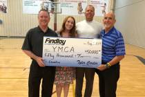 Findlay Automotive Group CFO Tyler Corder, left, provided a donation of $50,000 to YMCA of Sou ...