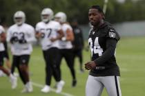Oakland Raiders' Antonio Brown, right, walks on the field during NFL football practice in Alame ...