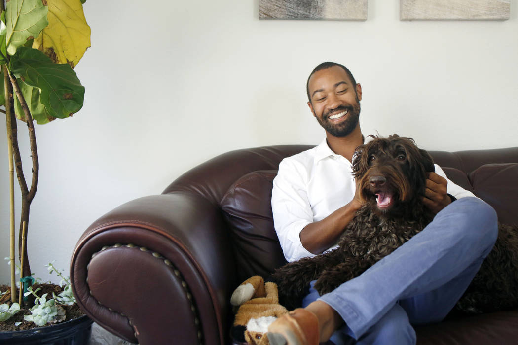 CEO of Silver State Health Ryan Linden with his dog Murphy, in his office at the Silver State H ...