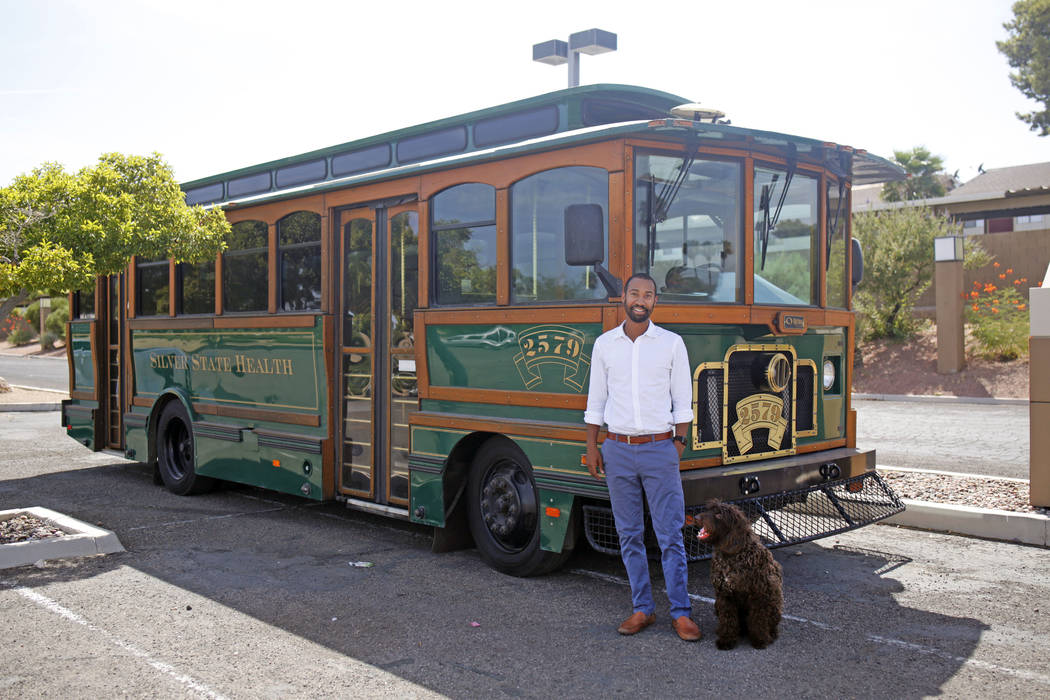 CEO of Silver State Health Ryan Linden with his dog, Murphy, in front of the Silver State Healt ...