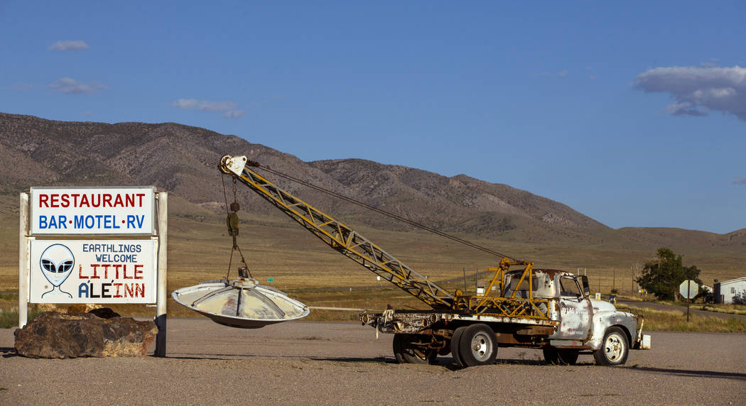 A spaceship hanging from a tow truck marks the entrance to the Little A'Le'Inn on Aug. 1, 2019, ...