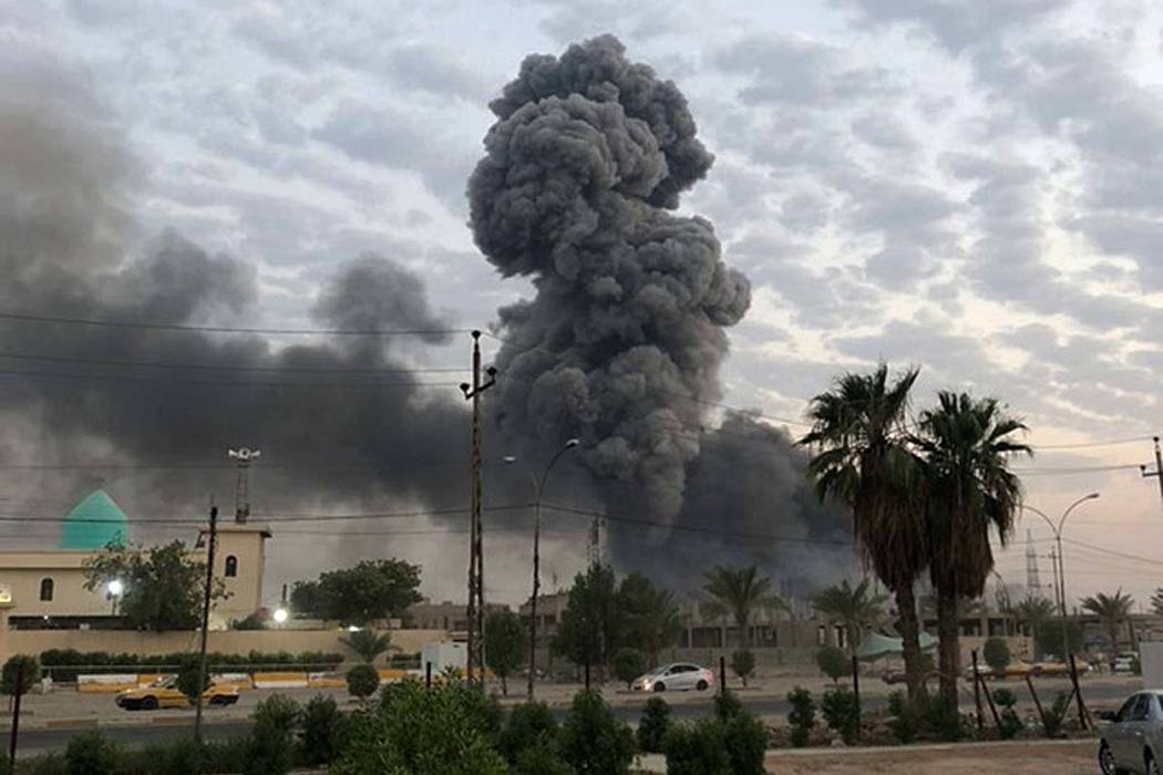 FILE - In this Monday, Aug. 12, 2019 file photo, plumes of smoke rise after an explosion at a m ...