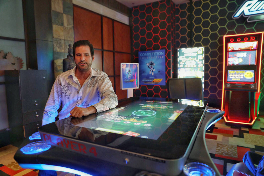 Gamblit CEO Eric Meyerhofer alongside a Model G machine at Planet Hollywood in Las Vegas on Tue ...