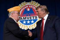 President Donald Trump greets AMVETS national commander Rege Riley at the American Veterans (AM ...
