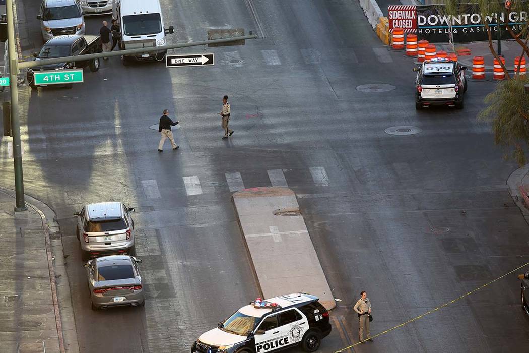 Police remain at 4th Street and Odgen Avenue in downtown Las Vegas, Thursday morning, Aug. 22, ...