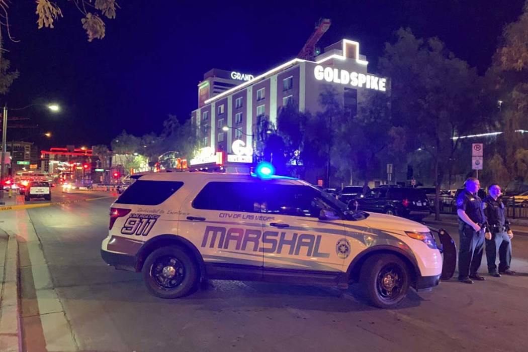 A large police presence is visible Thursday, Aug. 22, 2019, in downtown Las Vegas, at the corne ...