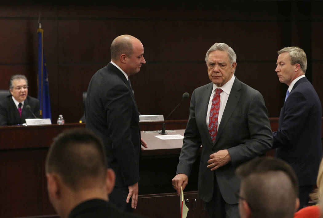 Dr. Tony Alamo, left, chairman of the Nevada Gaming Commission, watches as Matt Maddox, CEO of ...