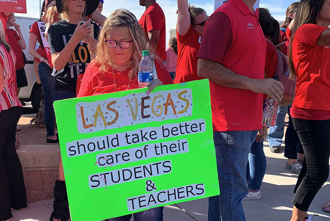 Clark County teachers and their supporters hold a rally outside Liberty High School in Las Vega ...