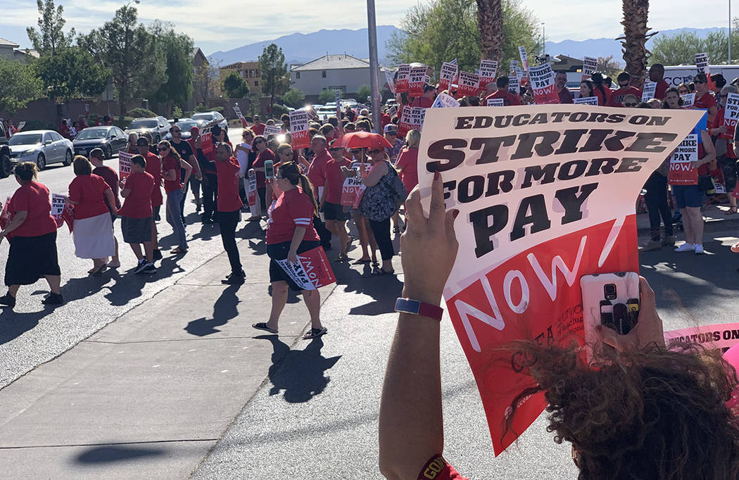 Clark County teachers and their supporters hold a rally outside Liberty High School in Las Vega ...