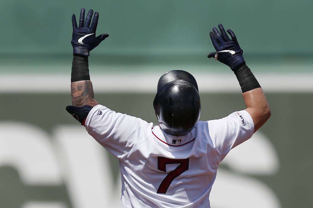 Boston Red Sox's Christian Vazquez celebrates his double during the 10th inning of a baseball g ...