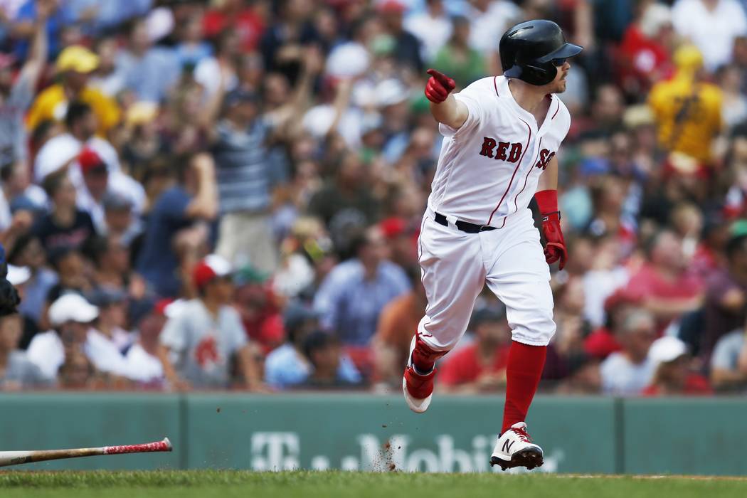 Boston Red Sox's Brock Holt runs on his game-winning RBI single during the 10th inning of a bas ...