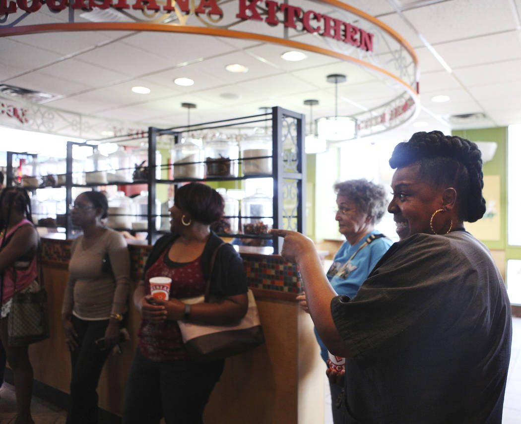 Angie Richard, right, laughs with others as they wait in line for the new chicken sandwich at P ...