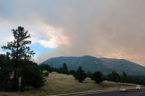Smoke rises Monday, July 22, 2019, from a wildfire burning in Flagstaff, Ariz. (AP Photo/Felici ...