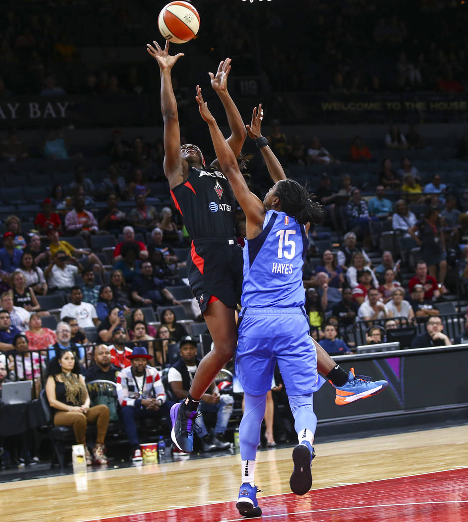 Las Vegas Aces' Jackie Young shoots against Atlanta Dream's Tiffany Hayes (15) during the secon ...