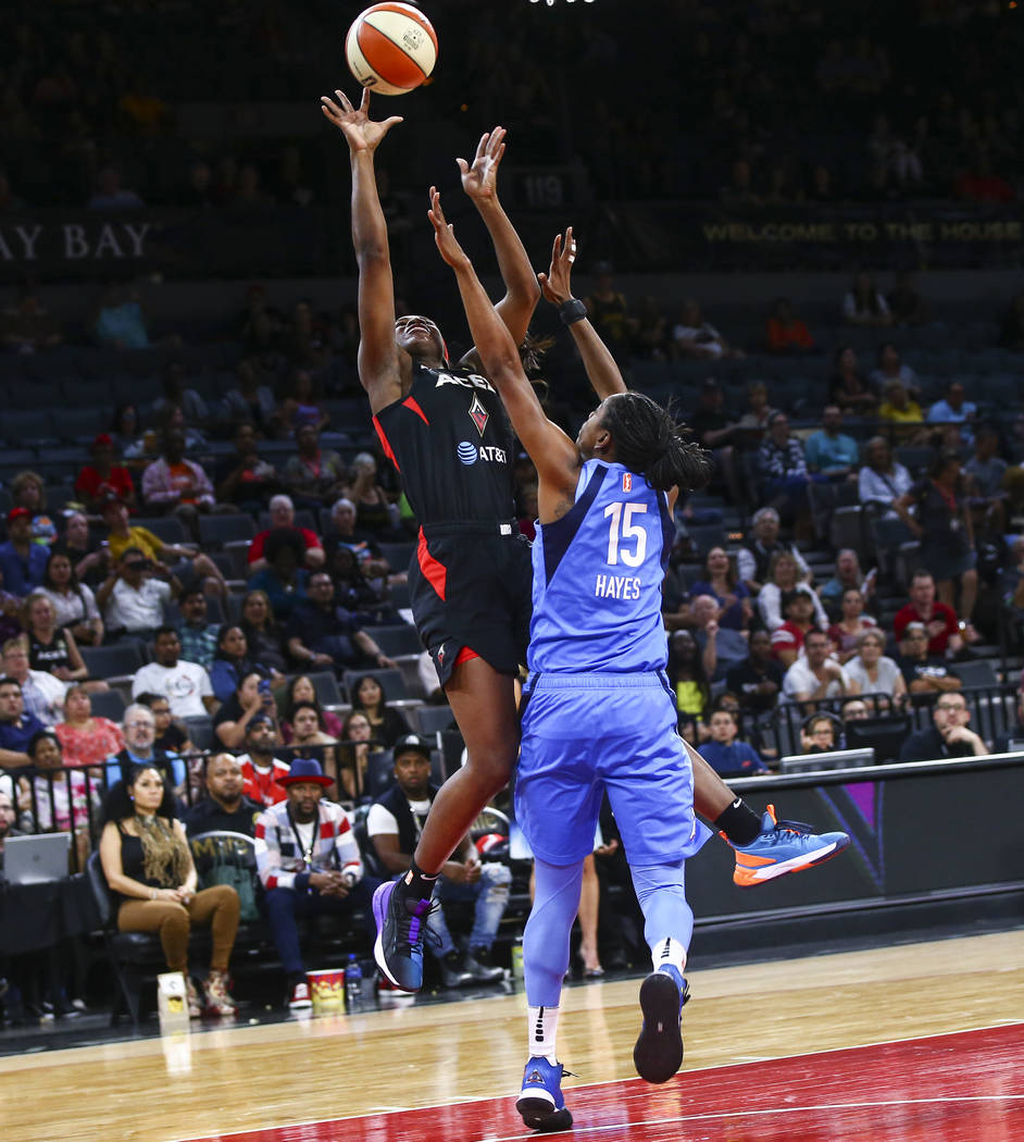 Las Vegas Aces' Jackie Young shoots against Atlanta Dream's Tiffany Hayes (15) during the secon ...