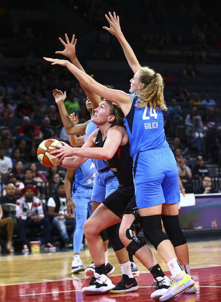 Las Vegas Aces center Carolyn Swords looks to shoot under pressure from Atlanta Dream's Marie G ...