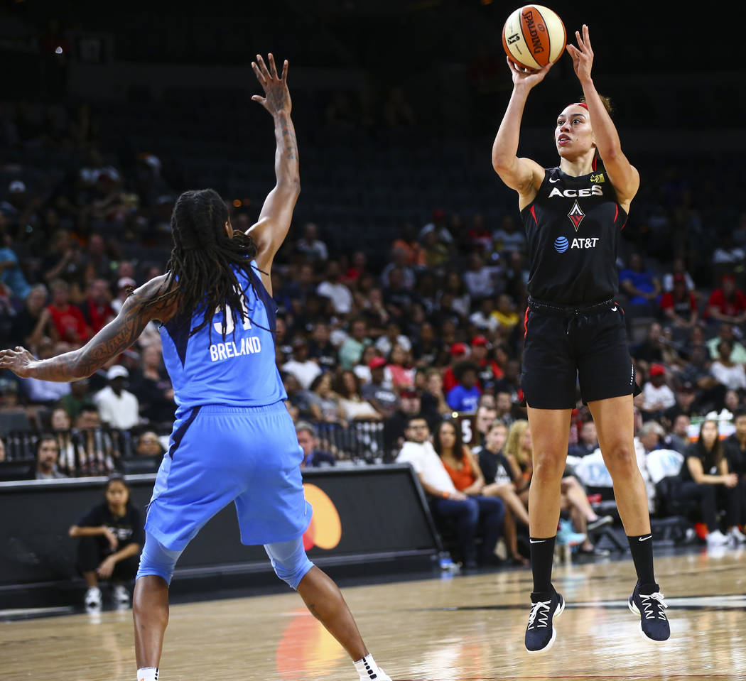 Las Vegas Aces' Dearica Hamby shoots over Atlanta Dream's Jessica Breland (51) during the secon ...