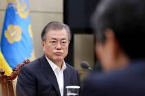 In this photo provided by South Korea Presidential Blue House, South Korean President Moon Jae- ...