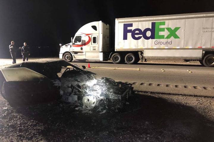 A charred 1993 Chevrolet Corvette and a FedEx truck at the scene of a fatal crash on Las Vegas ...