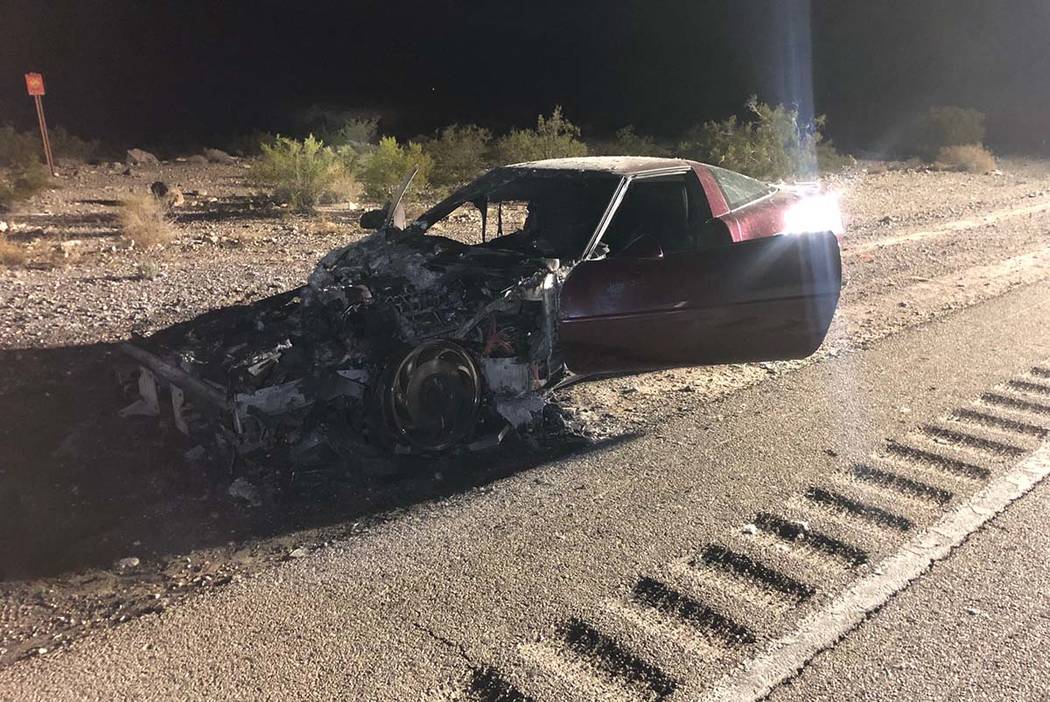 A charred 1993 Chevrolet Corvette sits on the side of the road on Las Vegas Boulevard South, Th ...