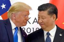 In a June 29, 2019, file photo, President Donald Trump, left, meets with Chinese President Xi J ...